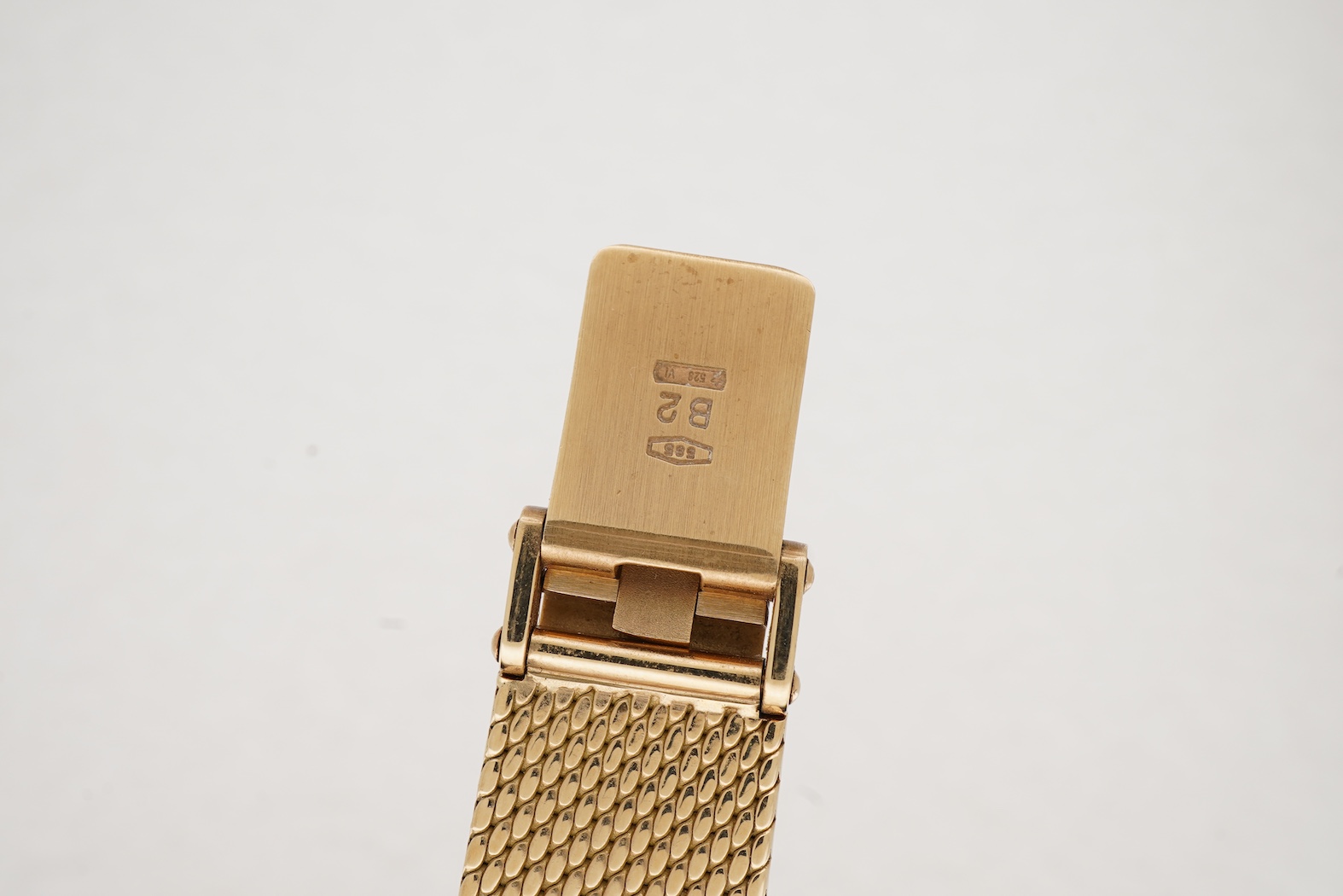 A lady's late 20th century Swiss Movado Museum 14k yellow metal quartz wrist watch, on an integral Italian 14k bracelet